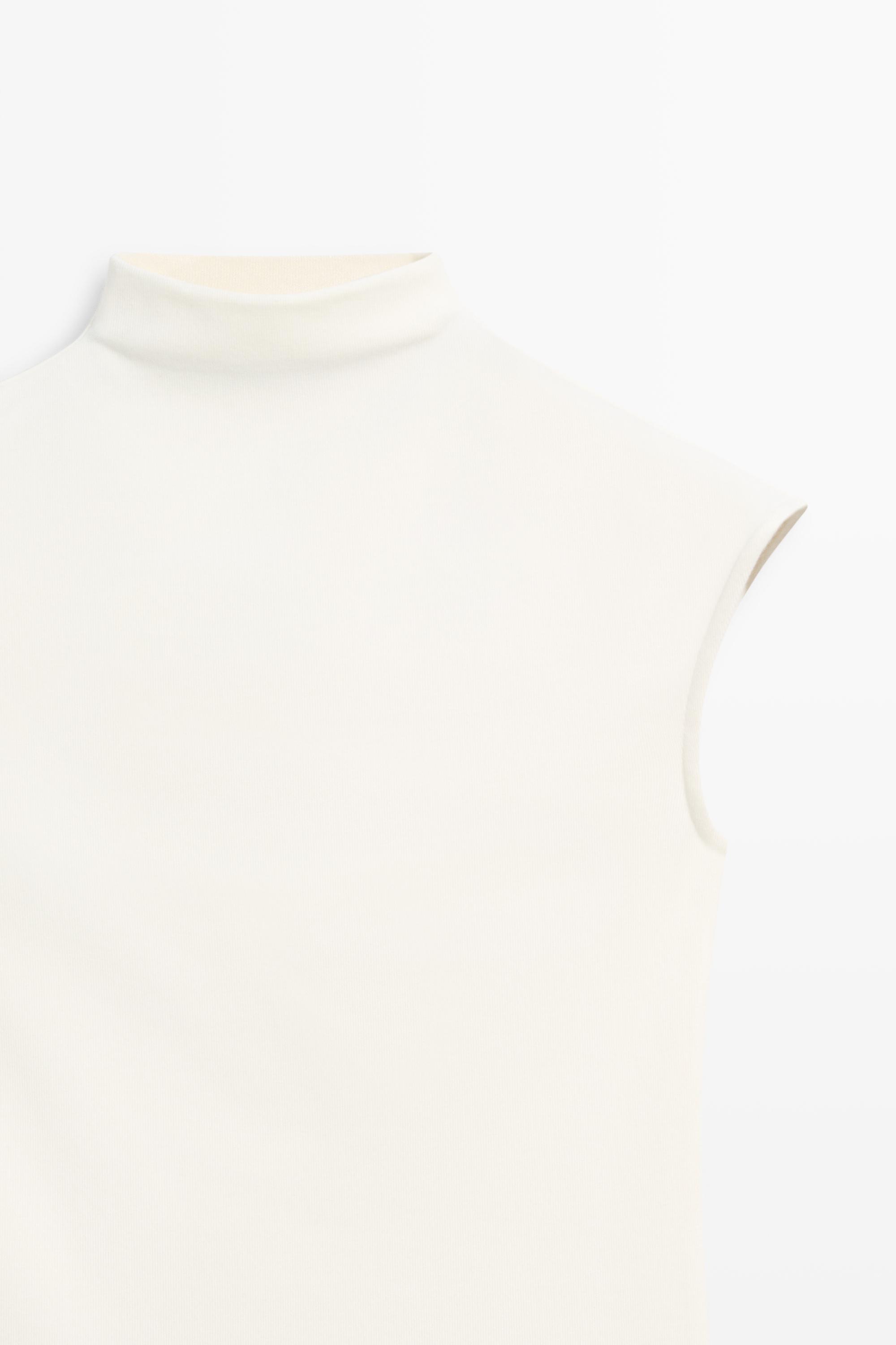 Top à col cheminée en maille extensible